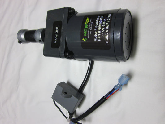 An Energylogic motor with gear box for a furnace, displaying a label with model details and an electrical plug.